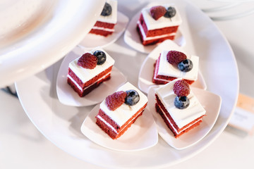 Pieces of Red velvet cake with berries