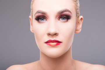 Close-up of sexy young blonde woman wearing make-up.