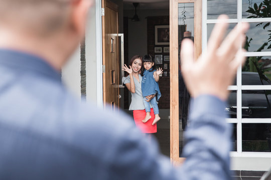 Kid Waving Goodbye To Parent