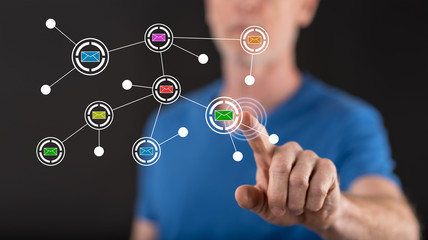 Man touching a communication network on a touch screen