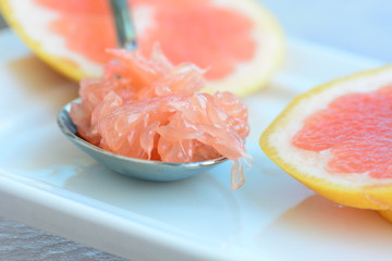 Fototapeta na wymiar Grapefruit pulp on a spoon