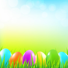 Easter background with grass and colorful eggs. Vector illustration.