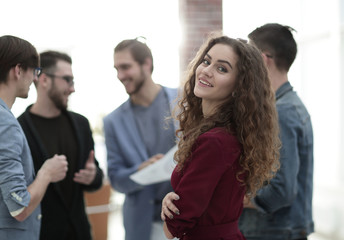 Fototapeta premium young business woman on the background of the employees.