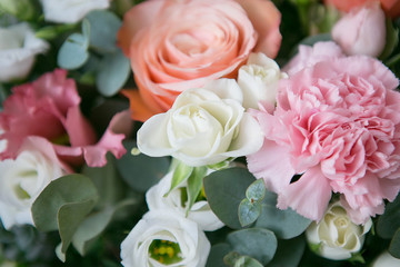 Delicate bouquet of roses, eustoma and cloves with eucalyptus branches
