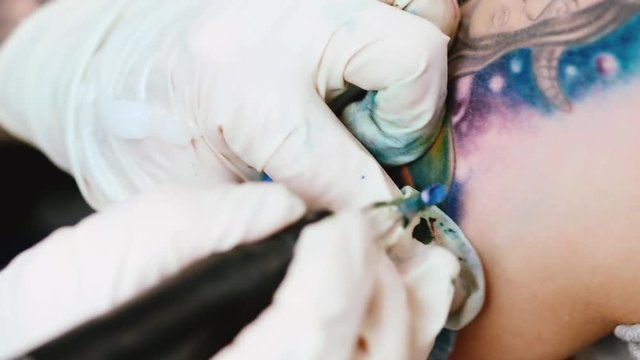 Tattoo artist make tattoo at the studio