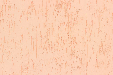 Orange color decorative wall plaster with bark beetle texture