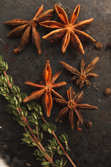 Anise stars and two sprigs of thyme