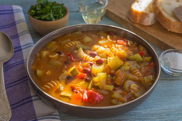Classic Italian rustic minestrone soup with beans and pasta