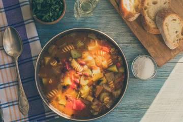 Traditional seasonal minestrone soup with beans and pasta