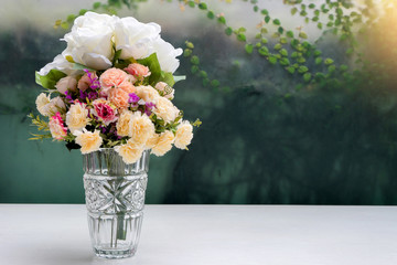 flower in glass vase on white table