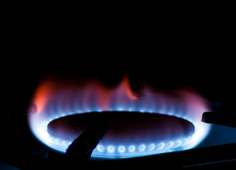 burner with blue gas, dark background