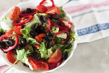 Organic vegetarian salad with vegetables and sauce.