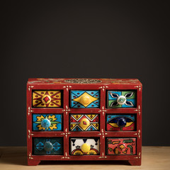 Small painted box with drawers for spices