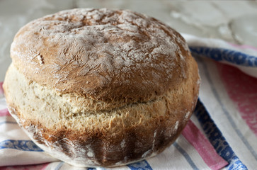 loaf of bread on wooden background,