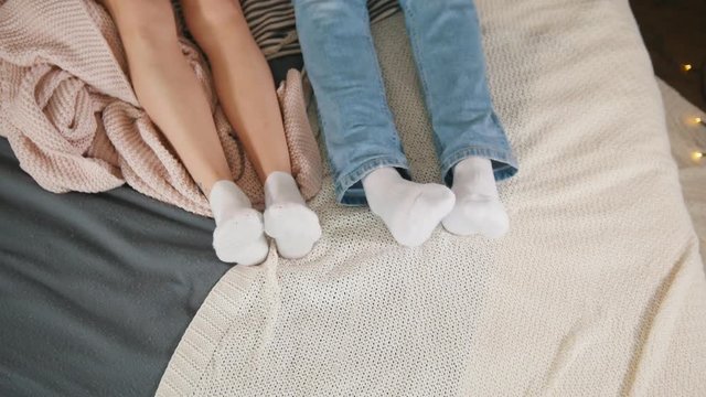Legs of young attractive couple cuddling and waking up together, family relationships