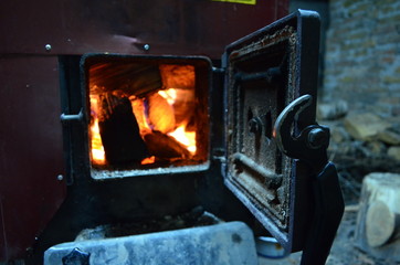 Wood-burning stove - piec opalany drewnem - obrazy, fototapety, plakaty