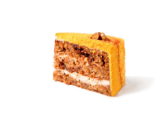 carrot cake with walnuts, prunes and dried apricots on a dark wood background. tinting. selective focus