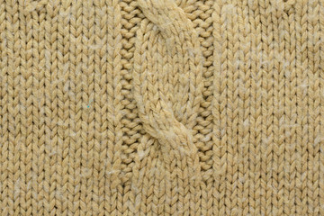 Knit Texture of Beige Wool Knitted Sweater with Cable Knits Pattern.