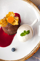 hot chocolate fondant with ice cream on white plate