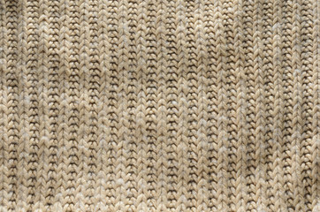 Knit texture of wool knitted fabric with regular pattern as background