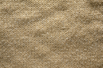 Knit Texture of Beige Wool Knitted Fabric with Regular Pattern. Knit Sweater Blank Background