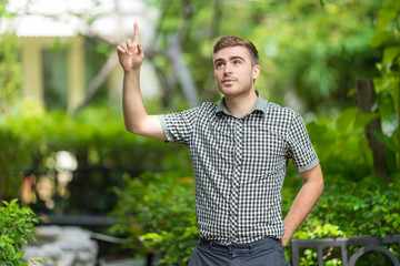 Handsome young man in the park.