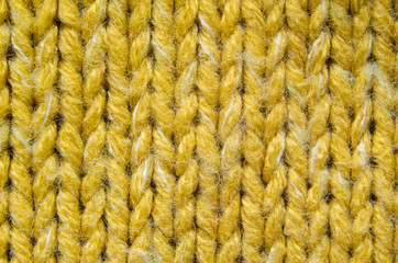 Yellow Knit Texture Close-Up. Knit Sweater Blank Background