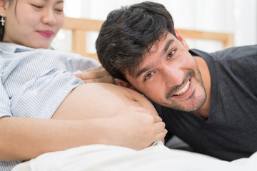 In Selective Focus Of Happy Family Checking New Baby In The Morning.Close Up Of A Beautiful Happy Pregnant Woman With Big Belly. Pregnancy And Motherhood Moment People And Expectation Concept.