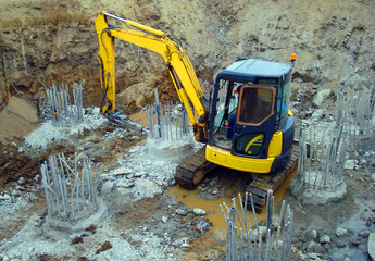 Mini excavator on the construction site