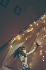 Child in a teepee