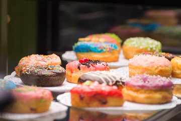 glazed doughnuts on the counter in the cafeteria closeup