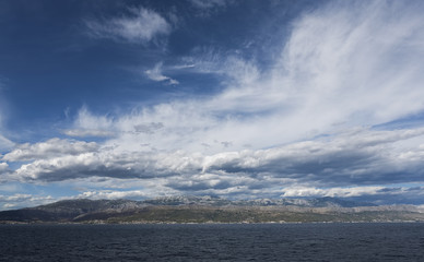 View from the ferry boat on dramatic sky over Adriatic sea 