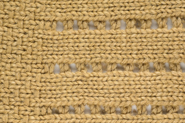 Knit texture of wool knitted fabric with regular pattern as background