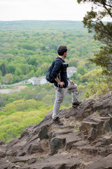 A man photographer hiking up a mountain