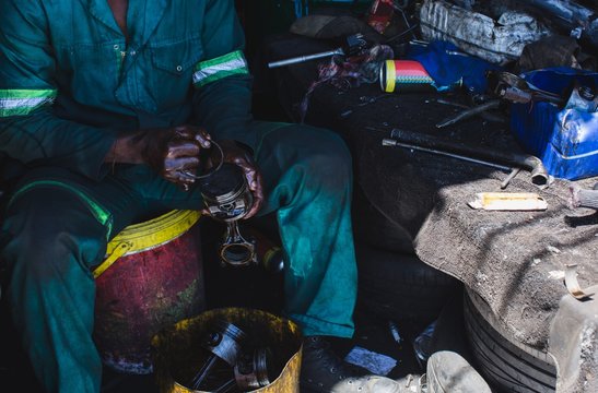 Mechanic repairing auto parts