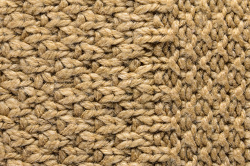 Beige Texture of a Knitted Sweater with Two Types of Knitting. Knit texture as background.