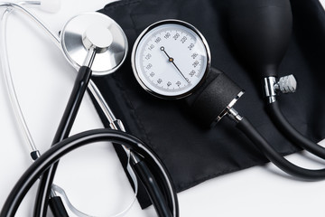 Cardiologist equipment - stethoscope and sphygmomanometer close up.