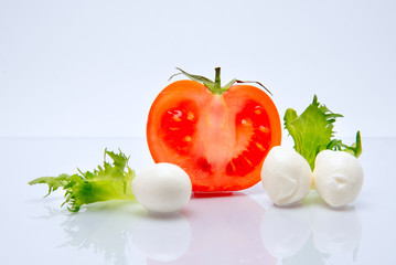 Tomato and cheese mozzarella organic food on white background