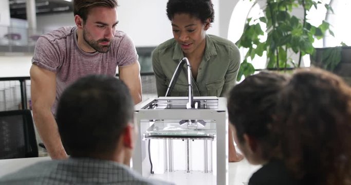Team working with 3D printer
