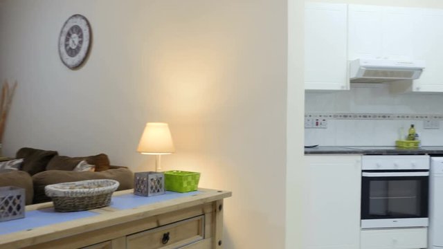 Stylish living room connect with small kitchen in the apartment studio