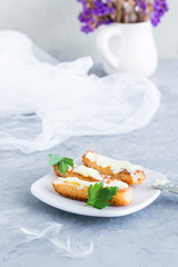 Fried toast with butter and parsley on a plate