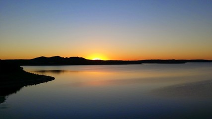 Fototapeta na wymiar Sunset Over Water