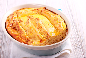 Pancake rolls with cheese filling, baked