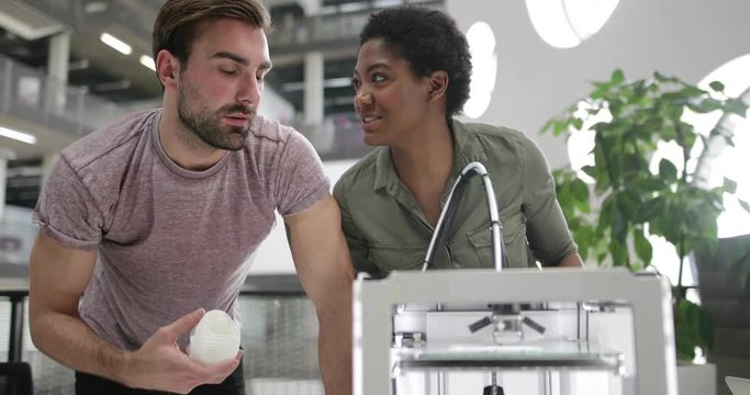 Team working with 3D printer