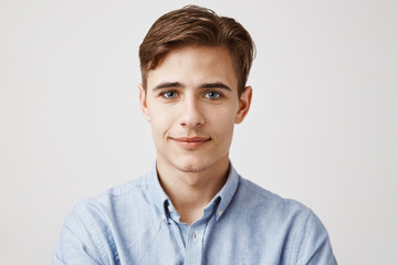 Portrait of handsome young man. Student won his first award in the university. Dean asked to take...
