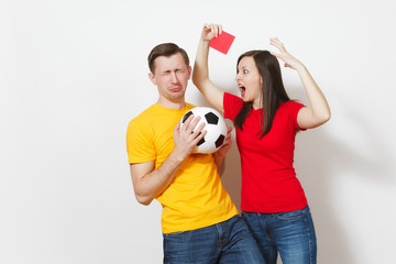 European angry aggressive young woman, football referee in red uniform show red soccer card,...