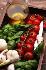 tomato and italian ingredient. Ripe tomatoes with fresh basil, garlic
