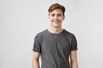 Handsome boyfriend smiles and looks to the camera. Young man is very glad his girlfriend got a...