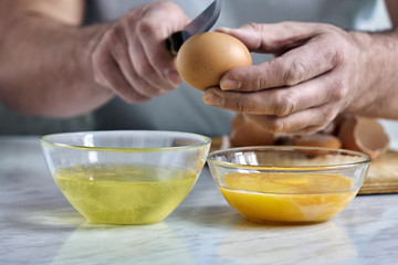 Obraz na płótnie Canvas Separation of egg into protein and yolk