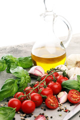 Obraz na płótnie Canvas tomato and italian ingredient. Ripe tomatoes with fresh basil, garlic